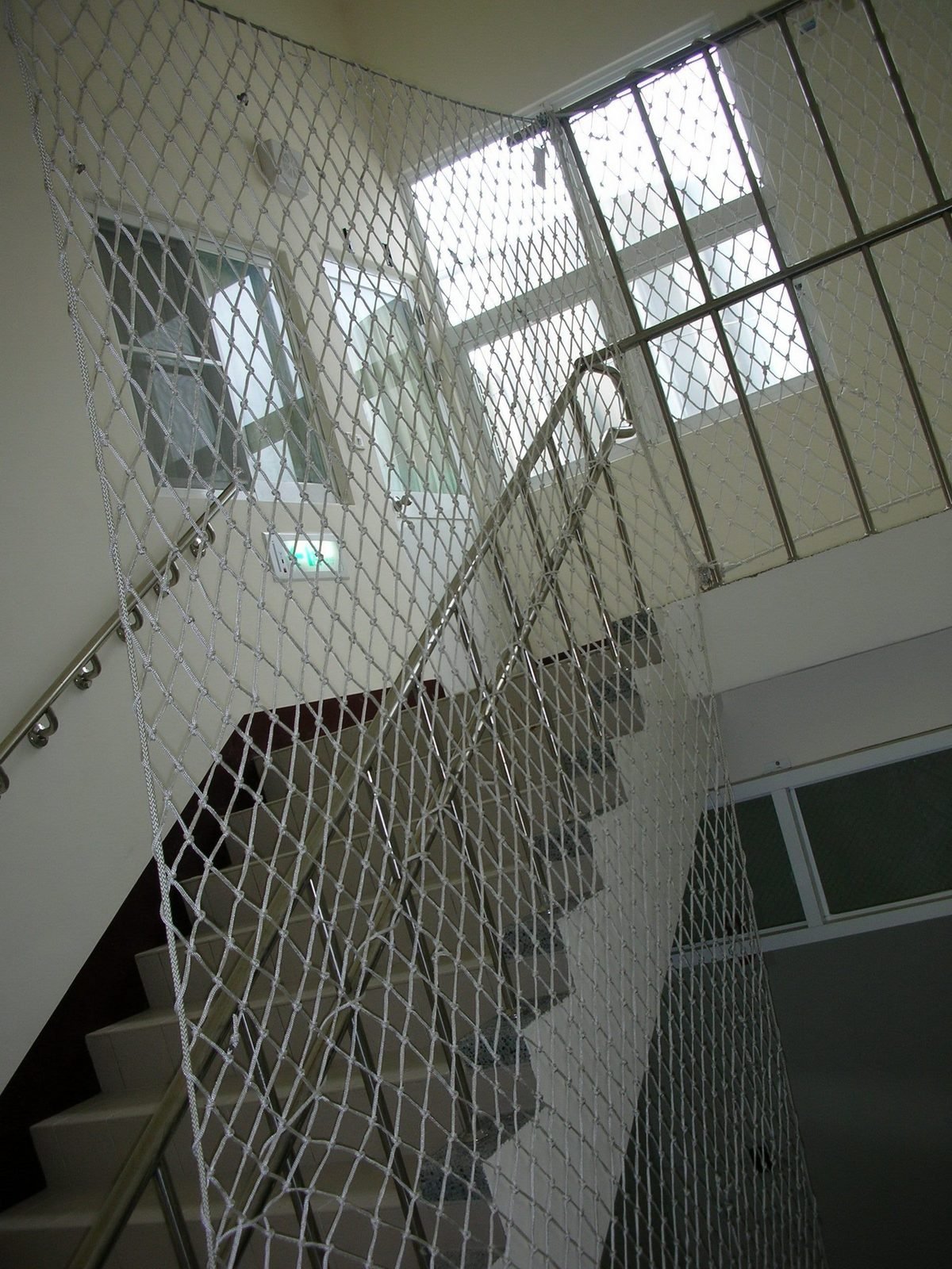 Stairwell fall-arrest netting