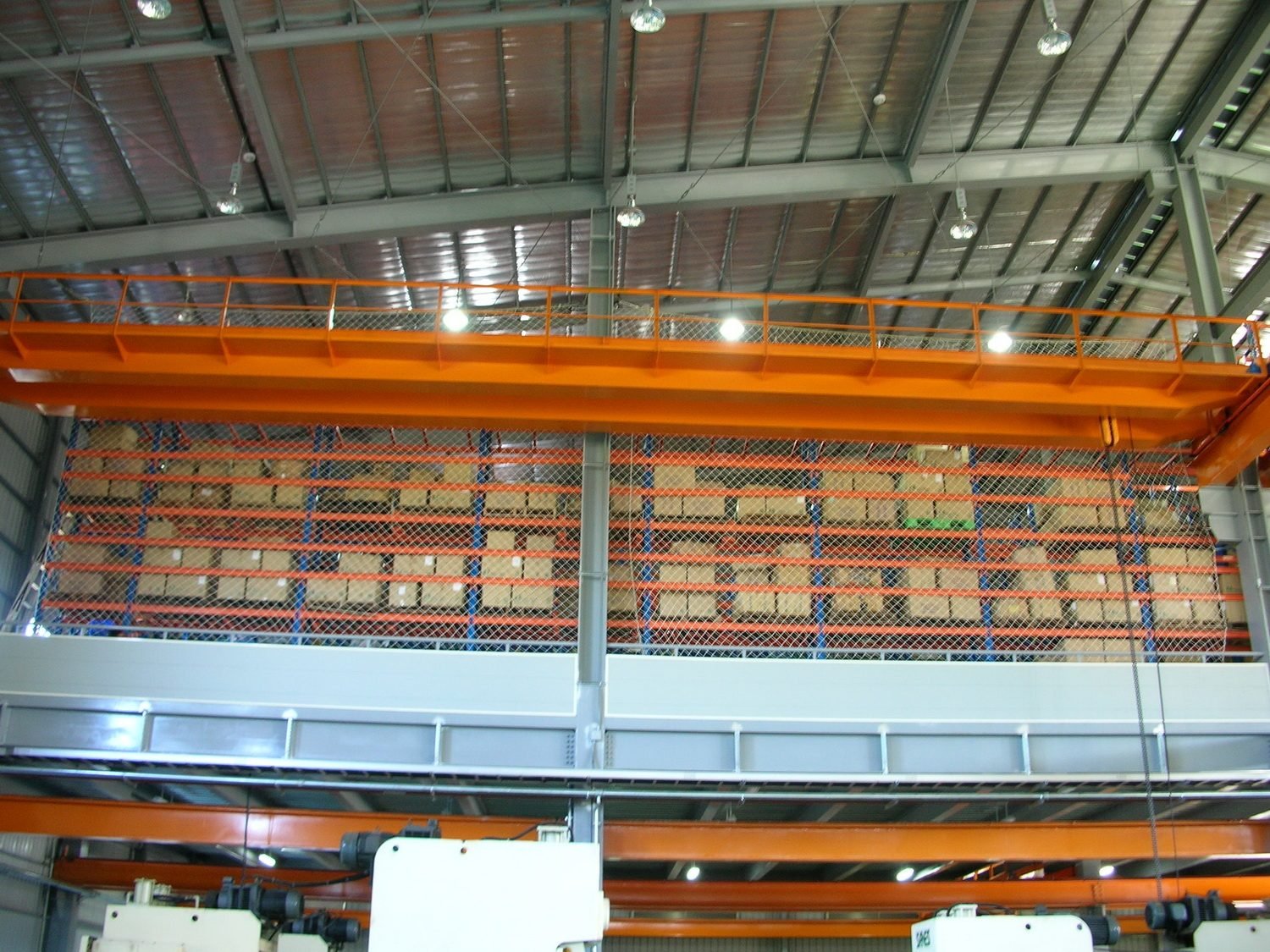 Racking netting beneath an overhead crane