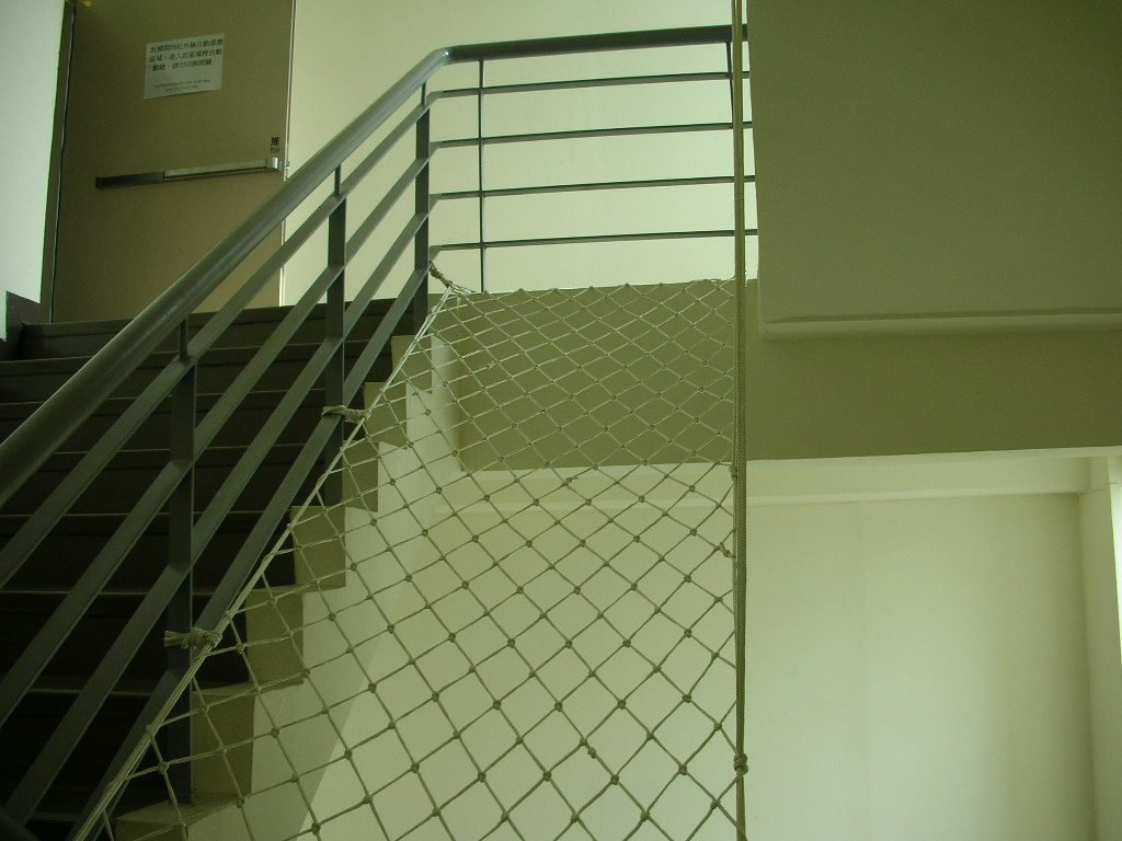 Protective netting beside a staircase