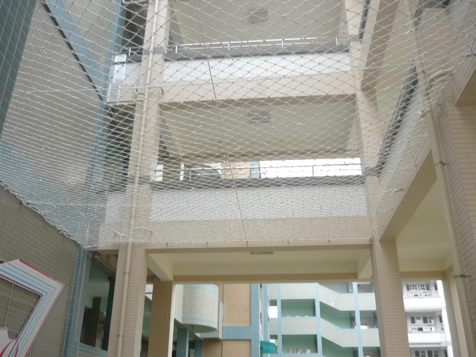 Fall-arrest netting between school floors