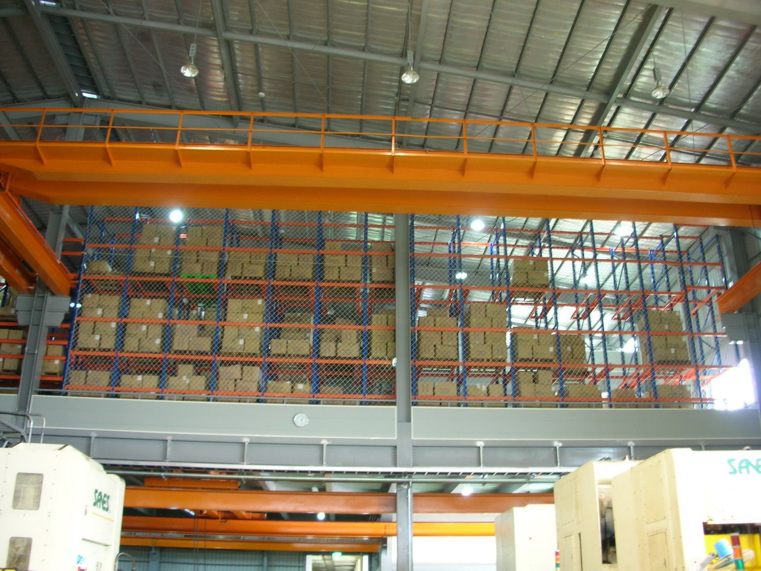 Fall-arrest netting on high-bay warehouse racking